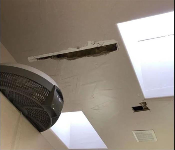 Damage drywall in a bathroom ceiling