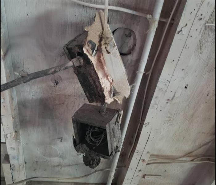 Fire damage to a garage door main power box