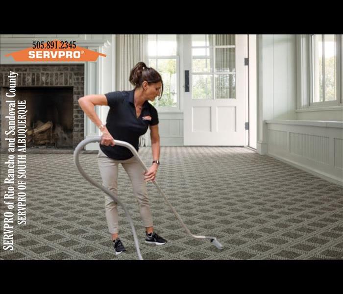 SERVPRO employee cleaning carpets